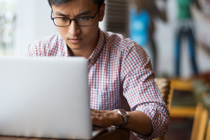 Person building an embedded GUI on a laptop